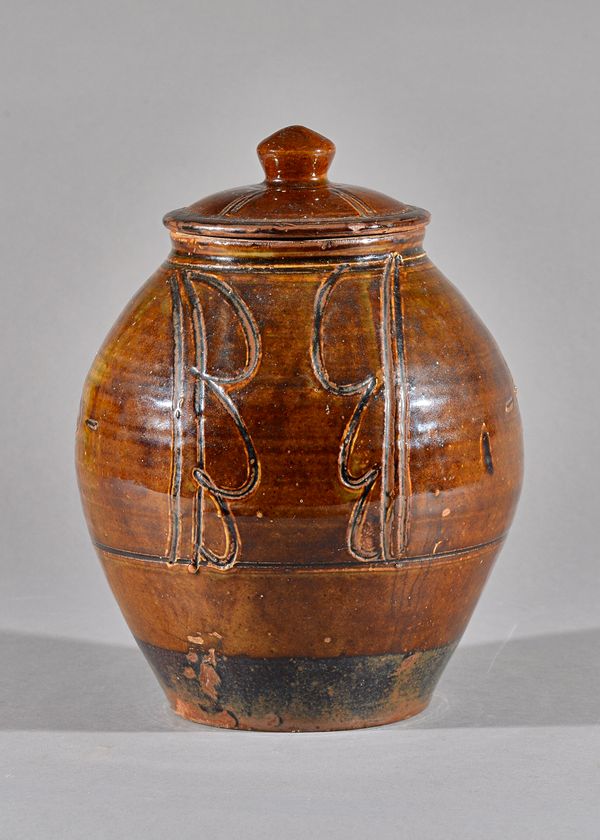 Thiebaut Chague (born 1958), a lidded jar, incised body with tenmoku type glaze, maker and studio marks, 29cm high.  DDS Illustrated.