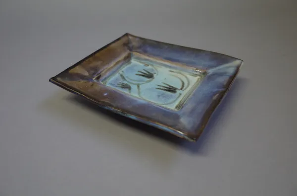 Michael OBrien, two early press moulded butter dishes of rectangular form, jun glaze over black slip, (a.f.), 18cm x 15cm, (2).  Provenance from the a