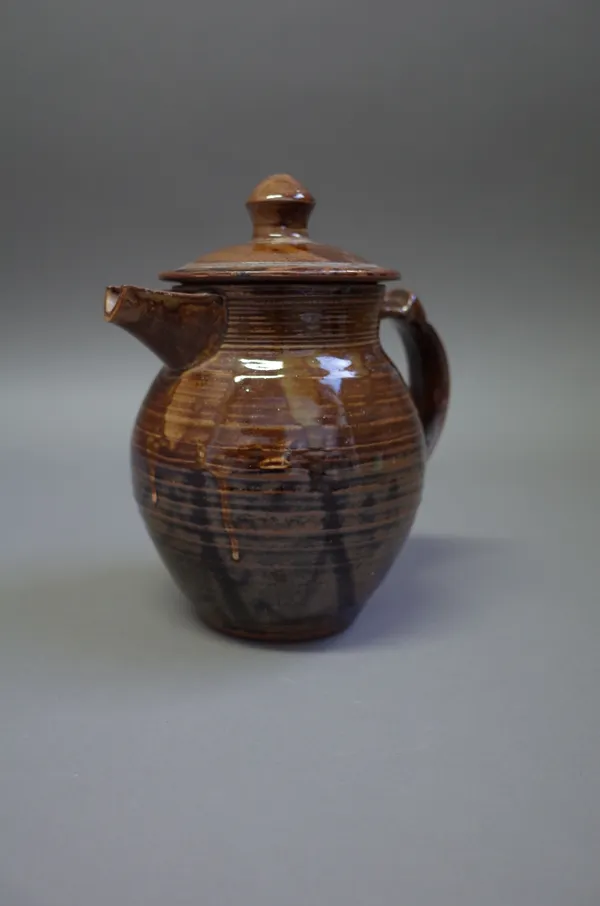 Michael OBrien, a lidded jug, tenmoku glaze with makers and Wenford Pottery marks, (a.f.), 19cm high.  Provenance from the artist.  DDS