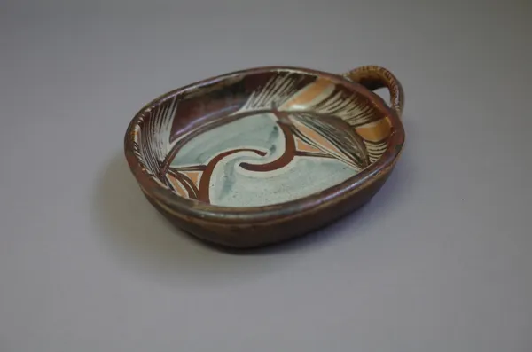 Michael OBrien, a press moulded dish with single handle, oxides over zircon glaze, 19cm wide.  Provenance from the artist.  DDS