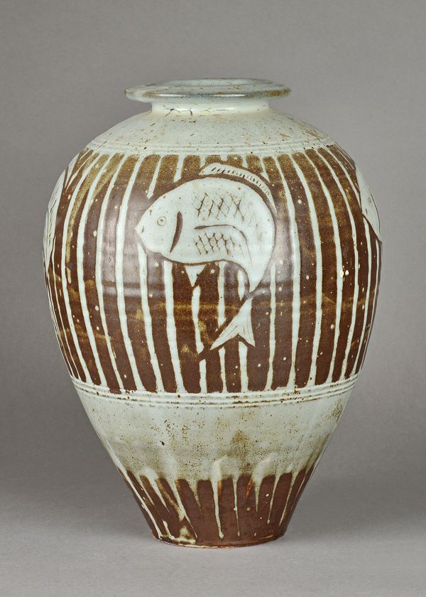 Tony Dasent, (South Heighton Pottery), a large vase with fish motif in slip decoration, makers mark, 37cm high.  DDS Illustrated.