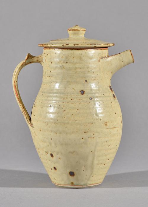 Gwyn Hanssen Pigott (nee John) (1935-2013), a lidded jug, wood fired with ash glaze, makers mark, 21cm high. Illustrated.