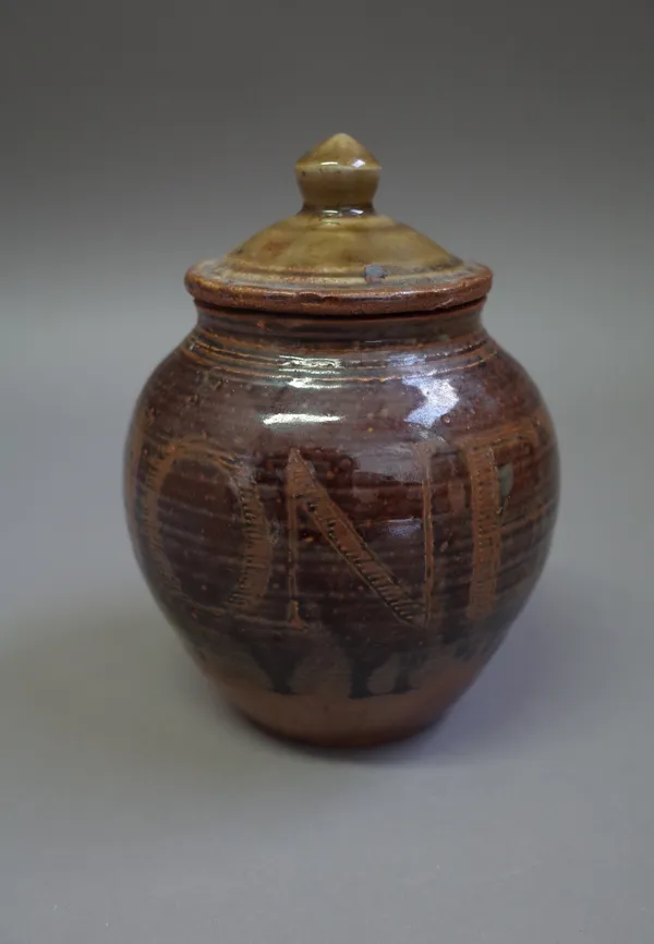 Seth Cardew (1934-2016), a honey pot, slip with incised design and ash glaze, maker and Wenford Bridge marks.  DDS