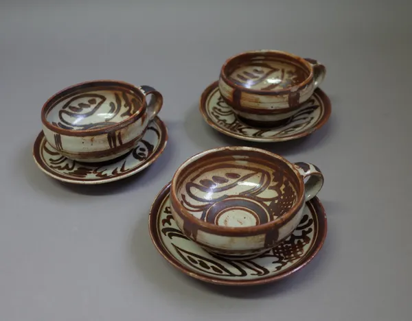 Seth Cardew (1934-2016), three open cups and saucers, iron brushwork, maker and Wenford Bridge marks, (one cup and saucer a.f.), (3).  DDS