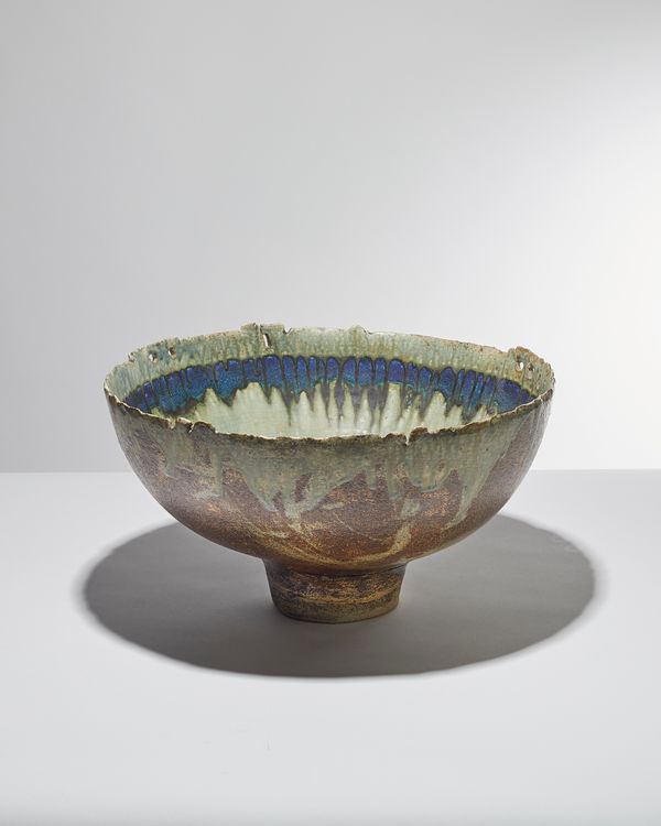 Derek Davis (1926-2008) a large thrown bowl with pinched out edge, copper with barium and ash glaze, mid 1980s, signed, 43cm diameter.  DDS  Illustrat