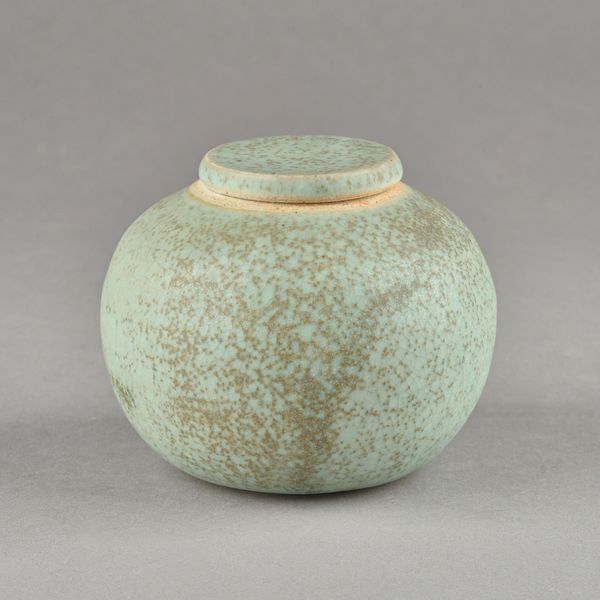 Emmanuel Cooper (1938-2012); a small green glazed bulbous jar and cover, 9.5cm high.  DDS Illustrated.