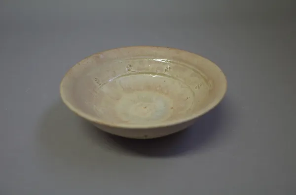 Jim Malone (born 1946), an open dish with yellow ash glaze, Ainstable period, makers marks, 15cm diameter.  DDS