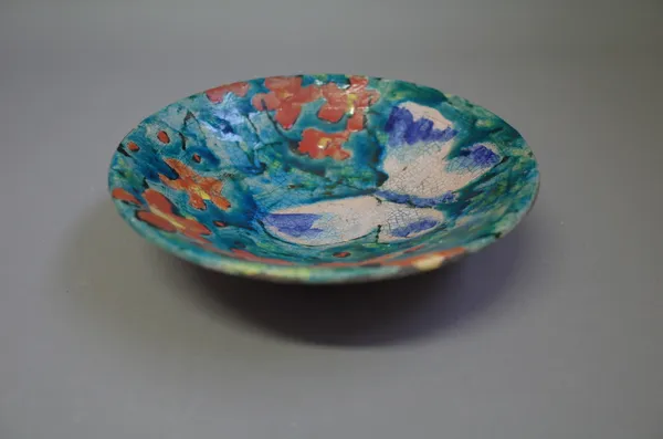 Josse Davis (born 1959), a raku dish decorated with butterfly and flowers, brushwork design, inscribed signature, 21cm diameter.