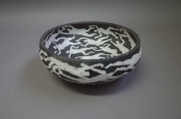 Josse Davis (born 1959), a large raku bowl, 'Swimmers' from his pagan theme, heavily carbonised, inscribed signature, 24cm diameter.