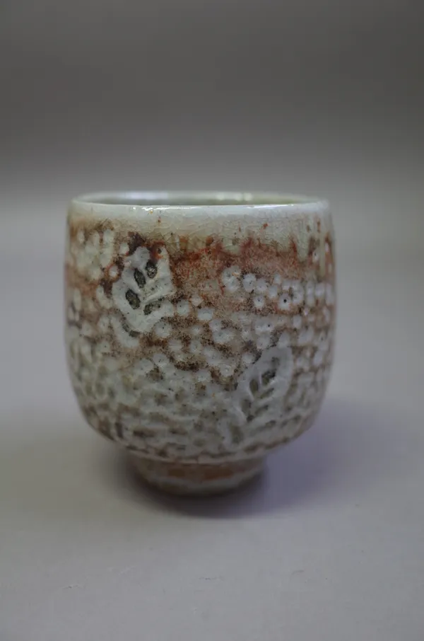 Phil Rogers, (born 1951), a yunomi, salt glazed, with impressed leaf pattern, makers mark, 10cm high.  DDS