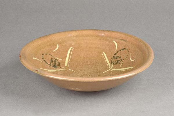 Attributed to Bernard Leach, thrown bowl with fritillary flower design decorated in slip, stoneware, makers and studio mark, 29cm diameter.  Illustrat