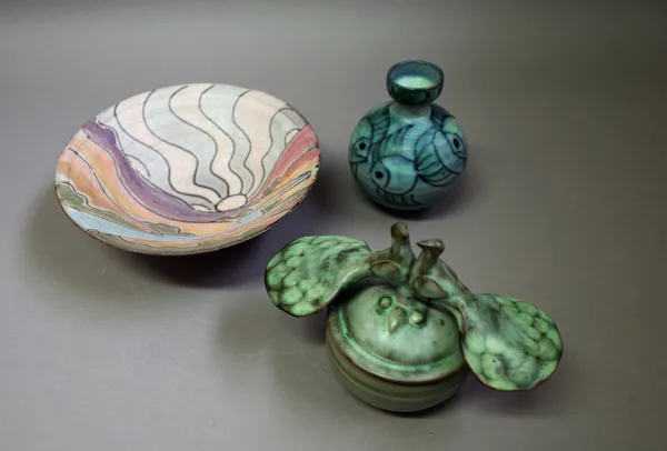 Tessa Fuchs (1936-2012), a bowl with sun motif, a vase with fish motif and a jar with peacock lid, all with makers stamp, 21cm diameter, (3).  DDS