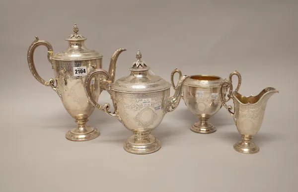 A Victorian silver four piece tea and coffee set, comprising; a teapot, a coffee pot, a twin handled sugar bowl and a milk jug, each piece of urn shap