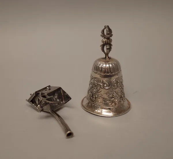 A European silver model of a windmill, of bell shaped form with embossed panels depicting figures in landscapes within floral and foliate scrolling su