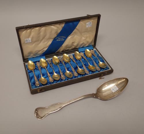 German flatware, comprising; a set of twelve parcel gilt coffee spoons, cast with scrolling decoration, engraved with coronets and monograms, with a f