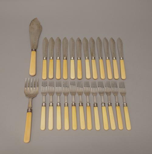 A pair of silver fish servers, with engraved decoration, Sheffield 1905, eleven fish knives, Sheffield 1904, one fish knife, Sheffield 1900 and twelve