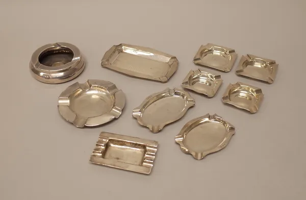 Silver, comprising; two pairs of ashtrays, Birmingham 1927 and Sheffield 1933, an ashtray mounted with a George V shilling 1934, London 1935 and five