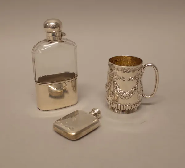 Silver and silver mounted wares, comprising; a Victorian christening mug, decorated with linen fold and foliate swags, above a fluted band and with a