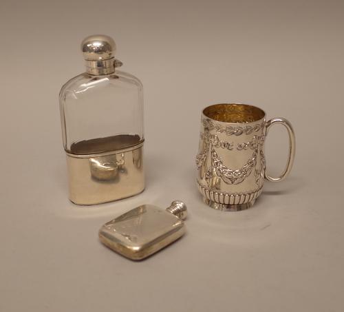 Silver and silver mounted wares, comprising; a Victorian christening mug, decorated with linen fold and foliate swags, above a fluted band and with a