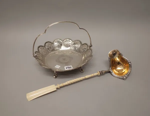 A Victorian silver cake or fruit basket, of shaped circular form, decorated with floral pierced panels, within an undulating beaded rim, raised on fou