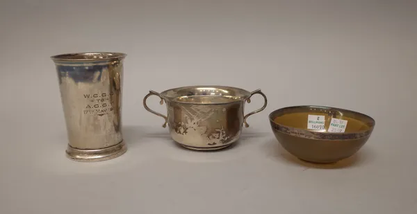 A silver beaker, of tapered cylindrical form, presentation inscribed, height 10cm, Sheffield 1905, a silver twin handled christening bowl, presentatio