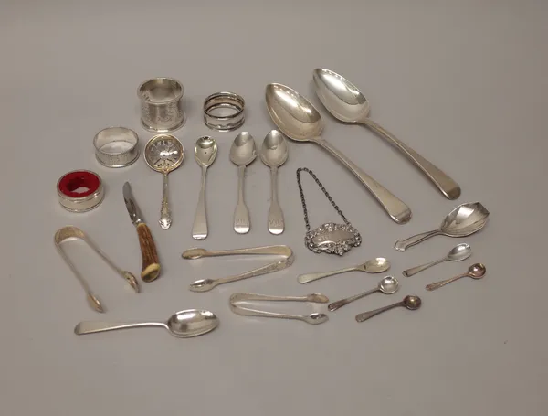 Silver, comprising; a pair of Old English pattern tablespoons, three napkin rings, a decanter collar drip catcher, three pairs of sugar tongs, a decan