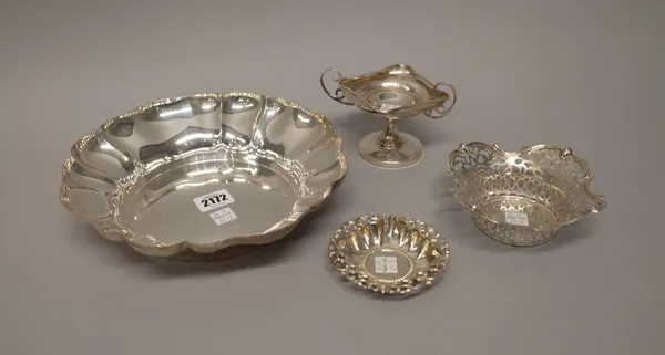 Silver, comprising; a shaped circular bowl, with lobed decoration, Birmingham 1972, diameter 23.5cm, a twin handled bonbon stand, (the foot loaded), C