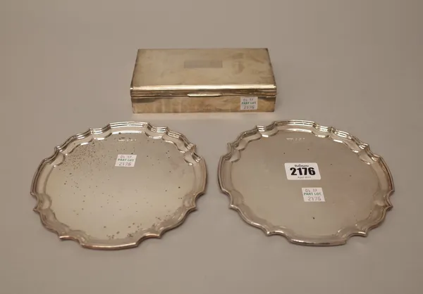 Silver, comprising; a pair of shaped circular card trays, having Chippendale style rims, diameter 15.5 cm, Sheffield 1973, combined weight 285 gms and