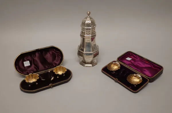 Silver, comprising; a sugar caster of octagonal baluster form, London 1907, height 20cm, a pair of Victorian salts, Birmingham 1893, with a pair of sa