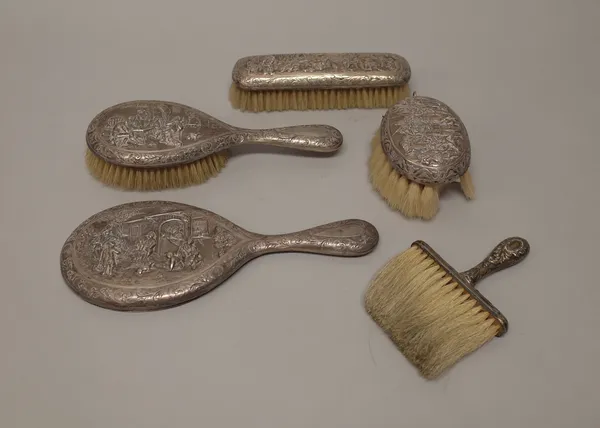 A Dutch four piece composite part dressing set, comprising; a hairbrush, a clothes brush, a smaller oval brush and a hand mirror, each piece decorated