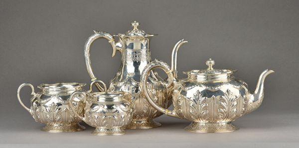 A Victorian silver four piece tea and coffee set, comprising; a teapot, a coffee pot, a twin handled sugar bowl and a milk jug, each piece embossed wi