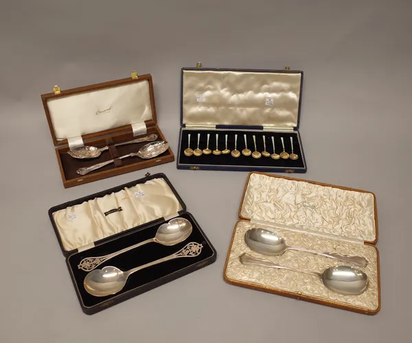 A pair of silver serving spoons, the handles with pierced decoration, Sheffield 1934, a pair of silver serving spoons, with shaped bowls and handles,