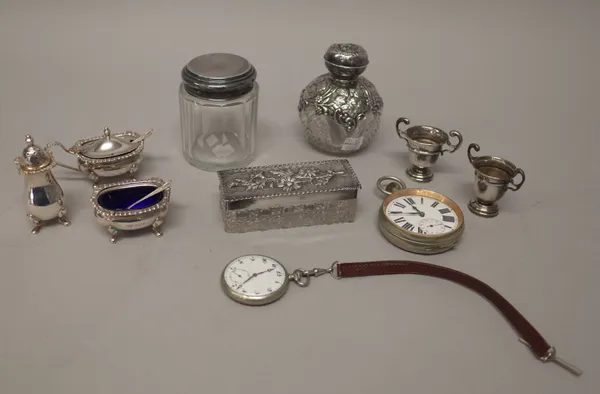 Silver and silver mounted wares, comprising; a faceted glass scent bottle, embossed with an angel choral scene, Birmingham 1904, a faceted glass toile