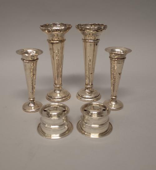 Silver, comprising; a pair of pen and ink stands, each of circular form, London 1899, with one glass liner and two pairs of vases, with loaded bases,