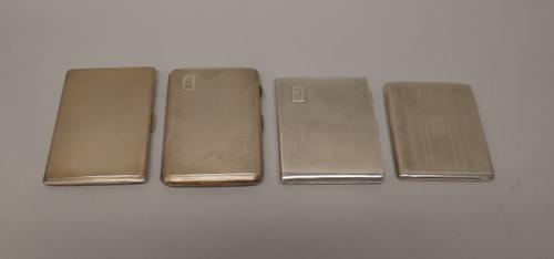 Silver, comprising; a rectangular cigar case, with engine turned decoration, Birmingham 1933 and three large cigarette cases, with engine turned decor