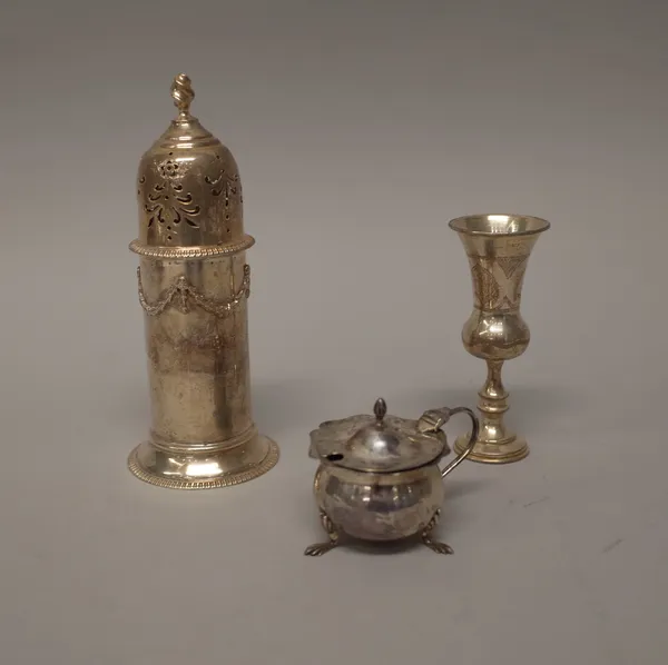 Silver, comprising; a sugar caster, the body decorated with pendant swags, the top with a wrythen knop finial, London 1912, a spirit tot, Birmingham 1