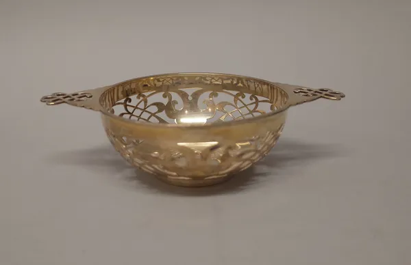 A silver twin handled bonbon bowl, with pierced decoration, Sheffield 1920, diameter 13.5cm, weight 210 gms.