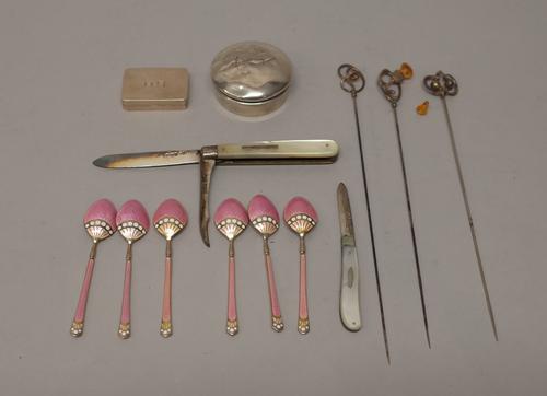 A set of six silver gilt, pink and white enamelled coffee spoons, Birmingham 1929 and silver and silver mounted wares, comprising; a rectangular hinge