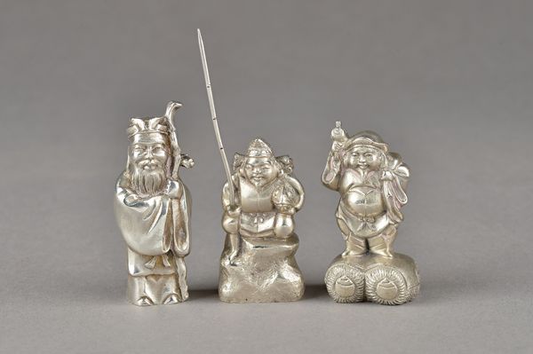 A group of three Chinese cast models of bearded men, including a fisherman holding a large fish, height excluding fishing rod 5cm, detailed 900, anoth