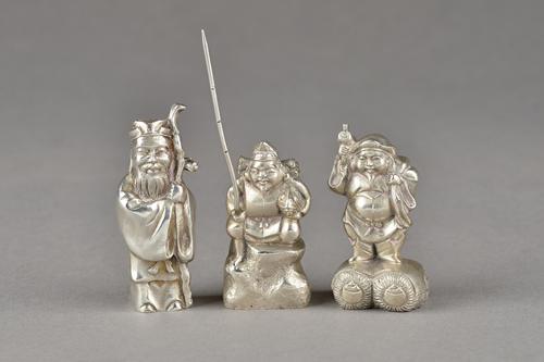A group of three Chinese cast models of bearded men, including a fisherman holding a large fish, height excluding fishing rod 5cm, detailed 900, anoth