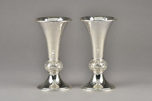 A pair of silver vases, each of flared trumpet shaped form, with a pierced bulbous stem above a flared circular foot, height 19.5cm, modern, combined