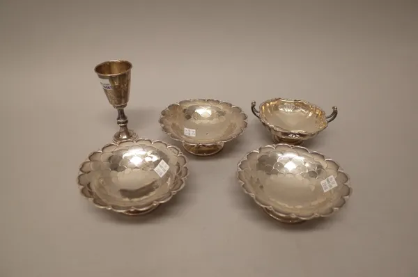 Silver, comprising; a set of three pedestal bonbon dishes, with scale formed decoration within pierced borders, Sheffield 1931, a twin handled bonbon