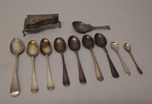 A silver hinge lidded box, modelled as a grand piano, with embossed decoration, import mark Chester 1902, five teaspoons, two salt spoons and a caddy