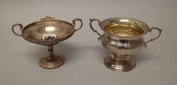Silver, comprising; a twin handled pedestal bonbon dish, decorated with engraved tied bows and pendant floral swags and with beaded rims, diameter 12c