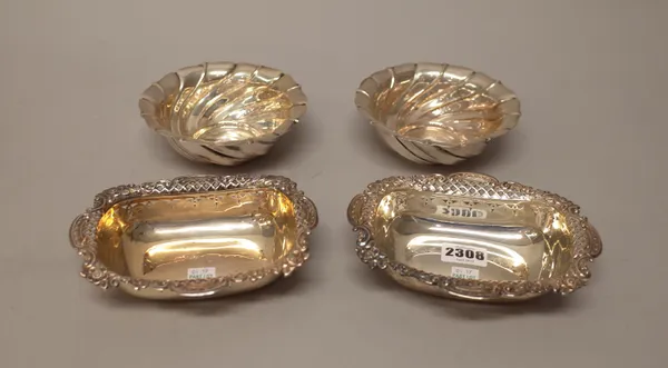 A pair of late Victorian silver bonbon dishes, each of shaped rectangular form, decorated with a floral and foliate embossed and pierced border, Sheff