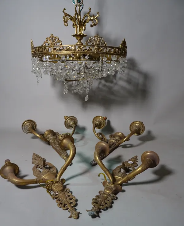 An early 20th century brass and glass bag ceiling light, 40cm wide, a pair of Regency style brass two branch wall lights and an 18th century style bra