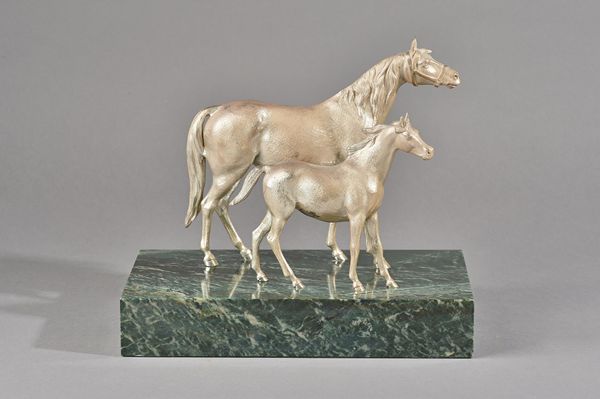 Mappin & Webb; a silver group of a horse and foal, hallmarked Mappin & Webb London 1973, on variegated green marble base, base 30.5cm wide X 26cm high