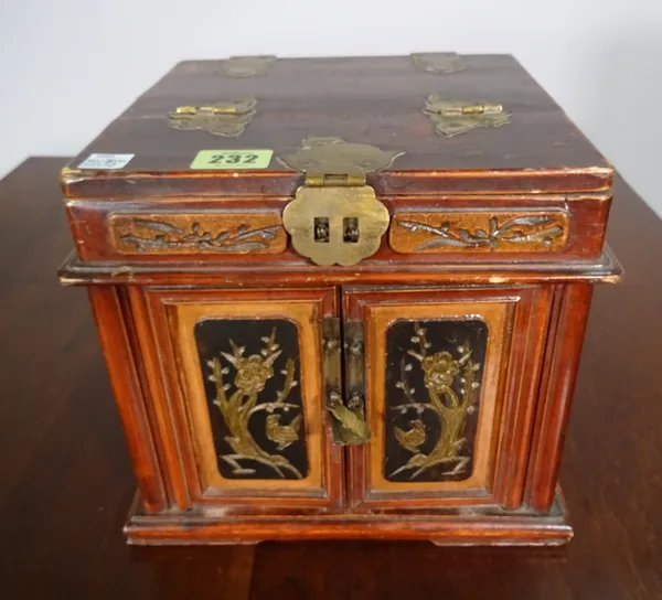 A 20th century red lacquer and brass bound Chinese jewellery box, 22cm wide x 22cm high.