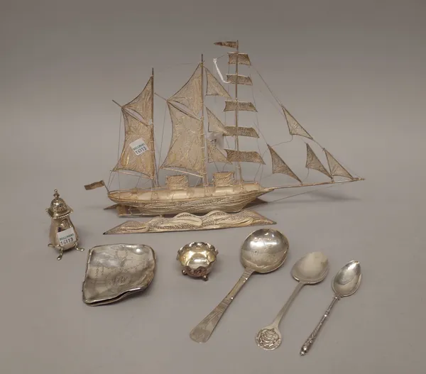 Silver and foreign wares, comprising; a filigree model of a three masted sailing ship, with a stand, a pepperette, a cigarette case (damaged), a spoon