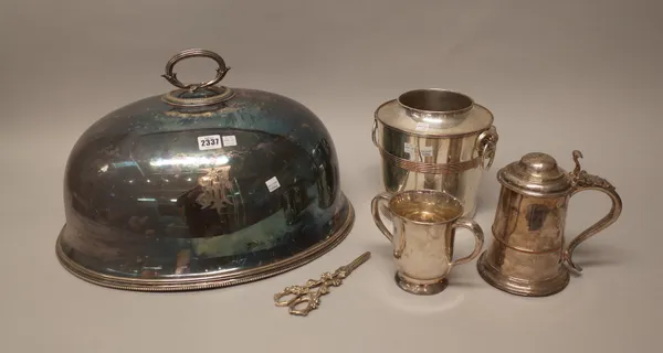 A group of plated wares, mostly 19th century, comprising; a large oval meat dome, with a loop shaped handle, a twin handled wine cooler, with ram's he